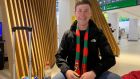 Mayo fan Niall Moran, who flew from London, at Knock airport. ‘I promised I’d come over if we beat Dublin, so that’s exactly what I did,’ he said.  Photograph: David O’Connor