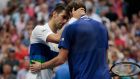 Daniil Medvedev greets  Novak Djokovic at the net after winning during the US Open at Flushing Meadows. Photograph: Kena Betancur/AFP via Getty Images