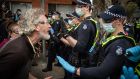 Anti-lockdown protesters clash with members of Victoria Police. Photograph: Darrian Traynor/Getty Images