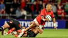 Simon Zebo offloads during Munster’s United Rugby Championship opener against the Cell C Sharks at Thomond Park on Saturday night. Photograph: Dan Sheridan/Inpho