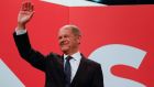German finance minister and Social Democrats (SPD) candidate for Chancellor Olaf Scholz waves at the Social Democrats headquarters after the estimates were broadcast on TV, in Berlin, on Sunday. Photograph: Getty Images
