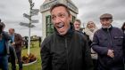 Frankie Dettori at Bellewstown Racecourse with Barney Curley’s famous phone box in the background. Photograph: Morgan Treacy/Inpho 