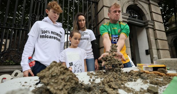Amanda and Paddy Diver with their children Reece and Savannah outside Leinster House on Thursday with samples of defective building blocks. Photograph: Nick Bradshaw