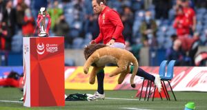  Lions captain Alun Wyn Jones leads his team onto the field with mascot BIL ahead of the game against Japan at Murrayfield. Photograph: Photograph:  Stu Forster/Getty Images