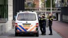 Police outside the court during the first session in the case against the suspects in the murder of Peter R de Vries, in Amsterdam. Photograph: Robin Van Lonkhuijsen/EPA