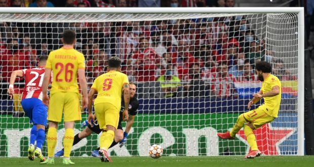 Mohamed Salah scores  Liverpool’s third goal from the penalty spot during the Champions League match against Atlético Madrid at Wanda Metropolitano  in Madrid. Photograph: David Ramos/Getty Images