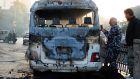 A burned bus at the site of a deadly explosion, in Damascus, Syria on Wednesday. Photograph: SANA/AP