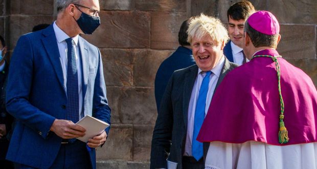 Minister for Foreign Affairs Simon Coveney with UK prime minister Boris Johnson speaking with Catholic Primate of All Ireland Archbishop Eamon Martin following a service to mark the centenary of Northern Ireland at St Patrick’s Cathedral in Armagh yesterday. Photograph: Liam McBurney/PA 