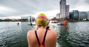 A swimmer makes their way to the start of the Jones Engineering Liffey Swim. Photograph: Inpho/Ryan Byrne

