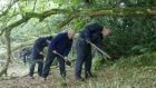 Gardaí pictured searching a wooded area at Taggartstown, near Kilcullen, Co Kildare. Photograph: Collins