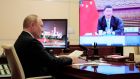 Russian president Vladimir Putin watches a video  address by China’s president Xi Jinping during the weekend’s G20 summit. Neither leader is attending the UN Cop26 climate change summit in Glasgow. Photograph: Evgeniy Paulin/ Sputnik via AP