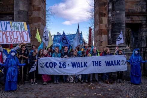 COP ON: A protest by members of Extinction Rebellion before the 26th session of the Conference of Parties, or COP26, on furthering solutions to the climate emergency, in Glasgow, Scotland. Photograph: Andrew Testa/New York Times
