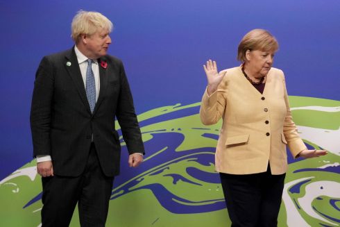 SAY HELLO, WAVE GOODBYE: British prime minister Boris Johnson with German chancellor Angela Merkel at the COP26 UN Climate Change Conference in Glasgow, Scotland. Photograph: Christopher Furlong/AFP/Getty 
