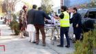 Emergency workers help injured victims of bomb blasts at a military hospital in Kabul. Photograph: EPA