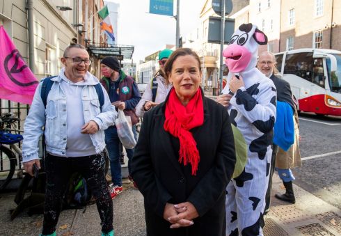 LOTS IN COMMON? Sinn Féin president Mary Lou McDonald pictured with members of climate crisis protesters Extinction Rebellion, across the road from Dáil Éireann, on Kildare Street, Dublin. Photograph: Tom Honan 
