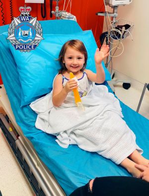 FOUND: Cleo Smith (4) waves as she sits on a bed in hospital on Wednesday in Carnarvon, western Australia. Police smashed their way into a suburban house on Wednesday and rescued Cleo whose disappearance from her family's camping tent on Australia's remote west coast more than two weeks ago both horrified and captivated the nation. Photograph: Western Australia Police via AP