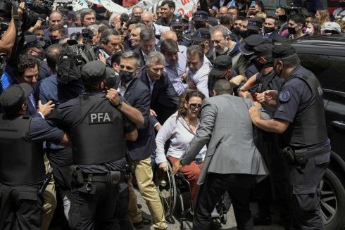 WIRETAPPING: Argentina's former president Mauricio Macri (centre) and former vice-president Gabriela Michetti (on wheelchair) arrive at the federal court in Dolores, Buenos Aires province, on November 3rd. Macri appeared before a judge on a probe into a wiretapping scandal, after the current president lifted an obstacle to him testifying. The investigation is looking into allegations that his government spied on relatives of 44 sailors who died in the sinking of a navy submarine in 2017. Photogrsph: Juan Mabromata/AFP via Getty