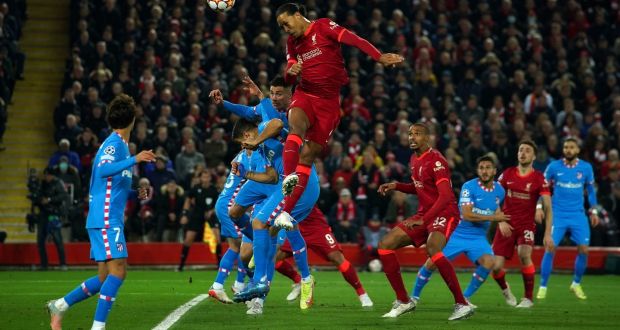 Liverpool’s Virgil van Dijk heads towards goal during the Champions League Group B match against Atlético Madrid at Anfield. Photograph: Peter Byrne/PA Wire
