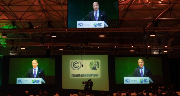   Amazon founder Jeff Bezos is displayed on screens speaking  during the Cop26 conference: the billionaire stepped off his private jet to give a speech  in Glasgow on the need to cut carbon emissions. Photograph: Erin Schaff/ Pool/AFP/Getty Images