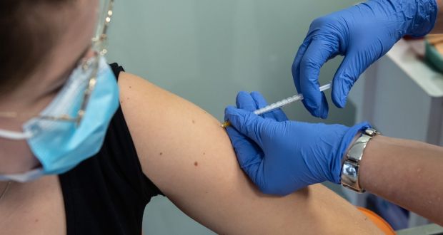 A person gets a booster vaccine against Covid-19 during campaign in Lublin, Poland. Photograph: Wojtek Jargilo/EPA