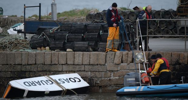 Debris from the Rescue 116 helicopter being taken to the pier in Blacksod, Co. Mayo. Photograph: Dara Mac Dónaill / The Irish Times