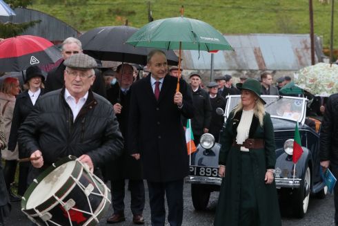 COMMEMORATION: Taoiseach Micheál Martin walks alongside Fianna Fáil TD Niamh Smyth during a commemoration of the late TD Paddy Smith, at St Brigid's church in Bailieborough, Co Cavan. Photograph: Brian Lawless/PA Wire 
