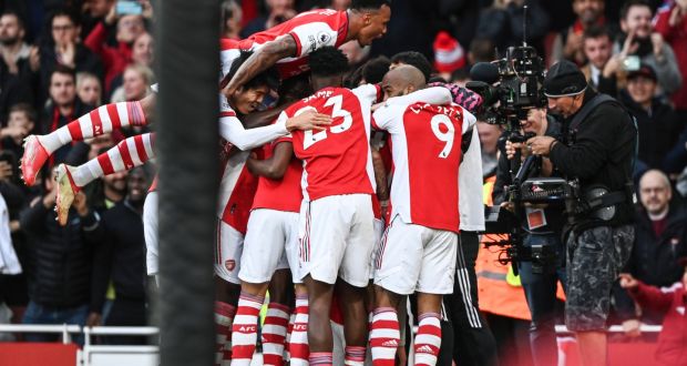 Arsenal’s Emile Smith Rowe celebrates with teammates after scoring the winner in their Premier League match against Watford. Photo: Facundo Arrizabalaga/EPA