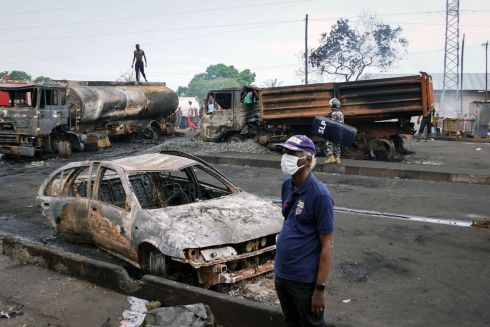 DEADLY FIRE: The aftermath of a major explosion and fire in Freetown, Sierra Leone, which killed at least 99 people. A fuel tanker was in collision with another truck, after which people gathered to collect leaking fuel, before the fuel ignited. People in other vehicles nearby were caught up in the disaster. Photograph: Saidu Bah/AFP/Getty
