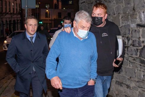 ACQUITTED: Luke O'Reilly (68, centre, in blue jumper), of Kilcogy, Co Cavan, who with others had denied charges of falsely imprisoning and intentionally causing serious harm to businessman Kevin Lunney. Mr O’Reilly was acquitted, and wept as his acquittal was read out in the Special Criminal Court. He is pictured leaving with family members and supporters. Photograph: Collins Courts
