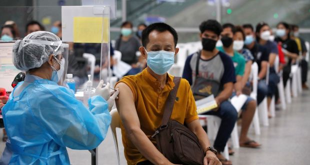 People receive a dose of AstraZeneca’s Covid-19 vaccine at a vaccination centre in Bangkok, Thailand. Photograph: Rungroj Yongrit