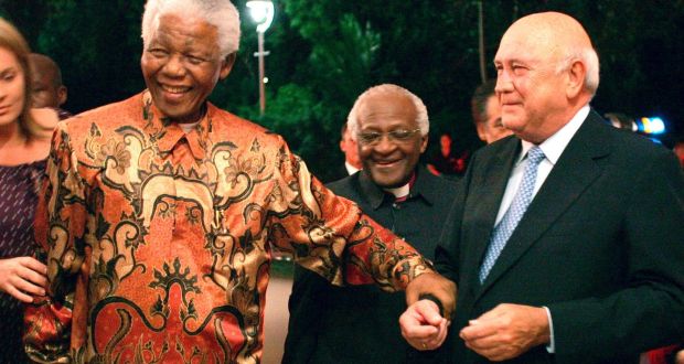 Former South African presidents Nelson Mandela, left, and FW de Klerk, right, with Anglican Archbishop Desmond Tutu, centre, at de Klerk’s 70th birthday party in Cape Town, South Africa. File photograph: Obed Zilwa /AP Photo
