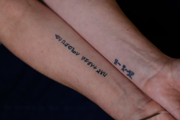 Siobhan’s tattoos of her son’s date of birth and a line from a song about adoption. Photograph: Alan Betson