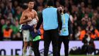Portugal’s Cristiano Ronaldo gives his shirt to a young Republic of Ireland fan who ran onto the pitch after the  World Cup qualifying match at the Aviva Stadium on Thursday night. Photograph: Brian Lawless/PA Wire