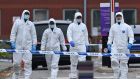 Police forensics officers at the Women’s Hospital in Liverpool on Monday, the scene of Sunday’s taxi explosion. Photograph: Paul  Ellis/AFP via Getty