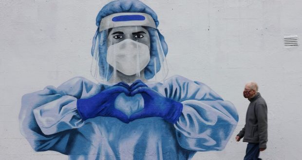 Mural of a healthcare worker in Harold’s Cross, Dublin: Modelling indicates that under pessimistic projections case numbers could rise to more than 12,000 daily. Photograph: Alan Betson