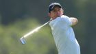 Rory McIlroy shines on day one to sit atop the leaderboard in Dubai. Photograph: David Cannon/Getty Images