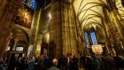 People queue up in St Stephen’s Cathedral in Vienna to receive a Covid vaccine jab while tourists look on. Photograph: Christian Bruna/EPA