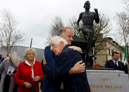 BIG WIN: Olympic gold medallist Ronnie Delaney embraces sculptor Paul Ferriter at the unveiling of a statue erected in Delaney's honour, in his hometown of Arklow, Co Wicklow. Delaney won gold in the 1,500m at the Melbourne Games in 1956. Photograph: Garry O'Neill