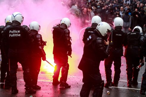 Protesters and riot place clash during an anti-coronavirus measures protest in Brussels Belgium on Sunday. Photograph: Stephanie Lecocq/EPA
