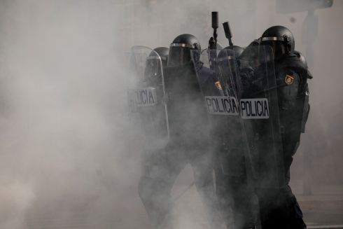METAL WORKERS STRIKE: Anti-riot police take positions during clashes with protesters during a strike organised by metal workers in Cadiz, southern Spain. Photograph: Javier Fergo/AP