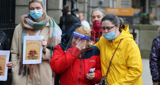  Rita Cahill  being comforted by friend Clodagh Ledwidge  outside the Dáil, where survivors of mother and baby homes gathered on Tuesday. Photograph: Nick Bradshaw 