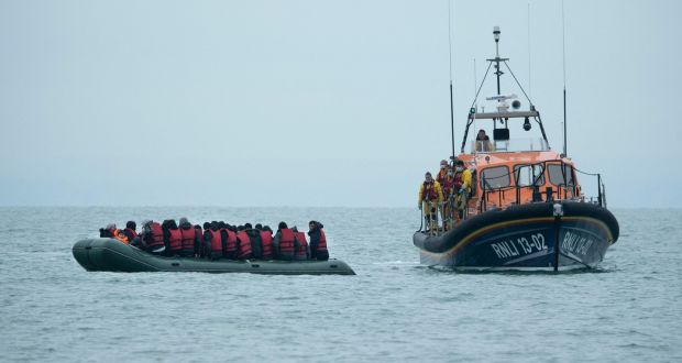 Migrants are helped by RNLI (Royal National Lifeboat Institution) lifeboat before being taken to a beach in Dungeness, on the southeast coast of England, on Wednesday. Photograph: Ben Stansall/AFP via Getty Images