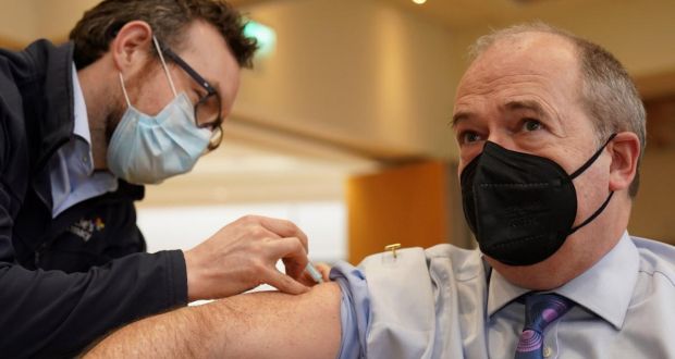 Northern Ireland’s chief medical officer Michael McBride receives  his Covid booster vaccine in a health centre in north Belfast. Photograph:  Brian Lawless/PA Wire