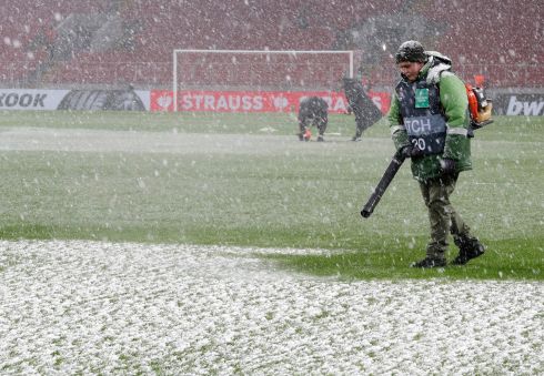 LET IT SNOW: Ground keepers at work on the pitch during a snowfall before the Uefa Europa League group C soccer match between FC Spartak Moscow and SSC Napoli at the Spartak Stadium in Moscow, Russia on Wednesday. Photograph: Maxim Shipenkov/EPA