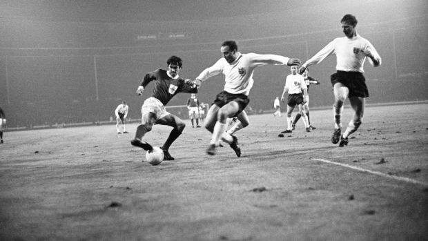 George Best is challenged by England’s George Cohen and Jack Charlton in a Home Championship match at Wembley on November 10th 1965. Photograph: Getty