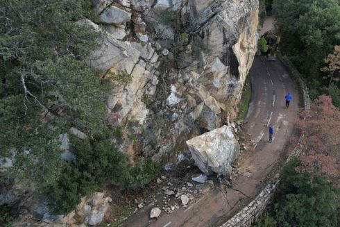 ROCKY ROAD: A rock that fell onto the Piana Calanches road in Piana in Corsica. Photograph: Pascal Pochard-Casabianca/AFP via Getty Images
