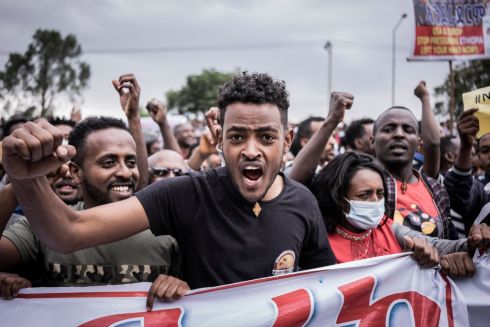 ETHIOPIA CRISIS: People gather at the British embassy during a protest against purported fake news and foreign meddling, in Addis Ababa, Ethiopia. Photograph: Amanuel Sileshi/AFP via Getty Images
