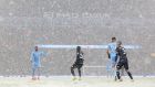 Snow came down heavily in Manchester during the match. Photo: Alex Livesey/Getty Images