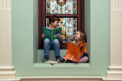 FEELING A LITTLE BOOKISH: Lukas (8) and Freida Schroder (4), from Belfast, at the National Library of Ireland, Kildare Street,  Dublin,  enjoying a read to celebrate Library Ireland Week 2021, running until Saturday, December 4th. See libraryirelandweek.ie. Photograph: Conor Ó Mearáin