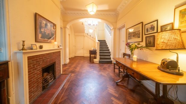 Hall with fireplace and parquet flooring